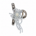 A silver-toned hair claw clip embellished with a sparkling clear crystal starburst, a central faux pearl, and cascading crystal strands, shown on a plain white background.
